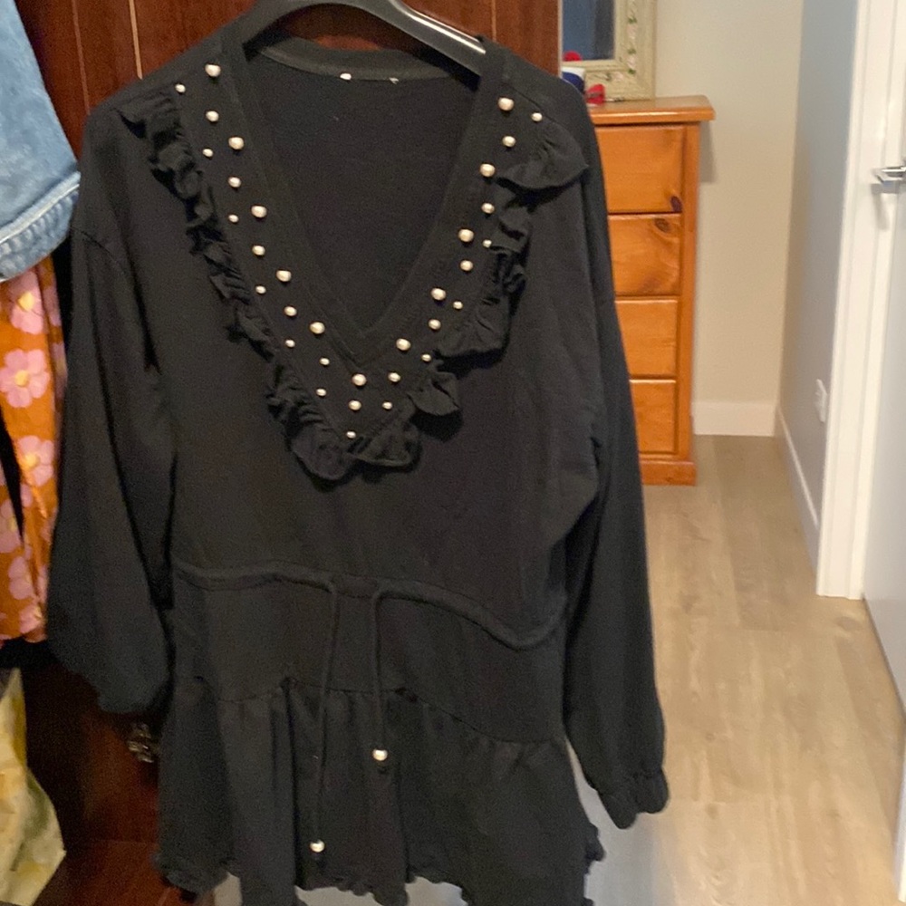 Stylish blouse goes well with jeans or leggings